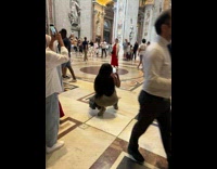 Woman in white and red dress poses inside the church