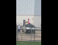 Two girls dance on white limo roof 