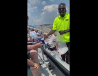 Man gives ice to crowd on hot day