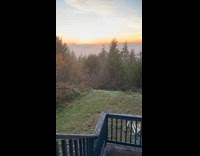 Man shows view of sunset on yard 