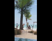 Girl lay on curved tree beach coconut