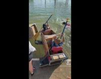 Mom watches sons cardboard boat race