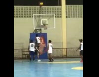 Kid Catches Opponent to Block Basketball Ring