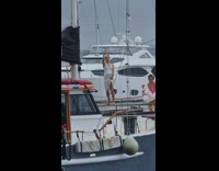 Three women dance with unicorn floaties boat