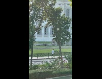 Man dramatic dance on a wall at the park