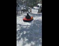 Collab Kale Salad IG -  Guy slides down snow hill on raft