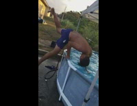 Slo-mo video boy front flips into pop-up pool
