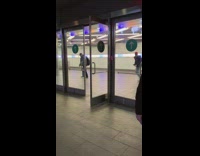 Gu riding skateboard jumps over station stairs 