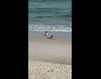 Girl white bikini kneel butt shot beach
