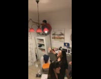 House party guy standing on shelf falls over