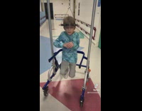 Little boy head brace in hospital hopping around 