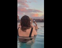 Ladies Take Pictures of their Friend in Pool