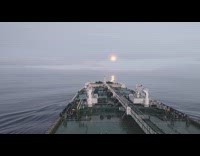 Oil tanker sails through the foggy clouds