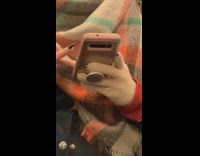 Black acrylic nails poke through glove lady 