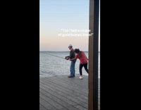 Woman pranks dad tugging on fishing pole 