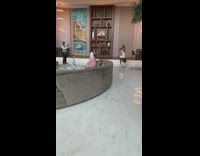 Woman in oversized shirt asks help with the attendant