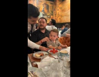 Dad giving little boy shoulder massage 