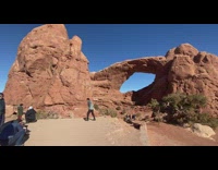 Guy grey jacket jump shot stone arch