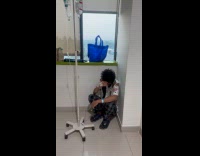 Two men on hospital bed instead of patient