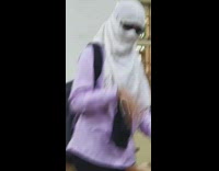 Girl puts on sunglasses and walks away