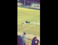 Football field halftime show girl backflips entire field