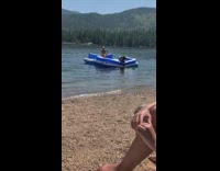 Yellow bathing suit girl inflatable raft lake