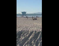 Woman pink blue bikini hula-hoop beach children