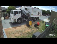Garbage truck driver breaks the garbage bin