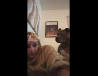 Dog hits girls face when she barks at it 