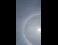 Halo around the sun seen from beach