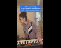 Girl in stripe shirt pretending to DJ on piano