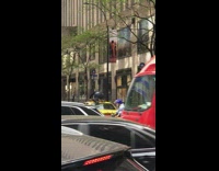 Man Crawls on Top of Taxi