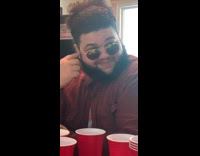 Guy stays quiet friend raps at party