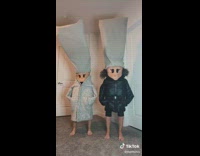 Girls with faces drawn on stomachs dance 