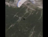 Collab extremeIG - man on white redbull paraglider 