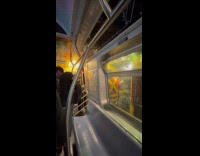 Passengers line up evacuate the southbound train