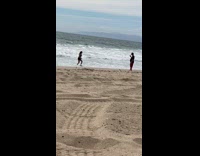 Black bikini top shorts girl beach sand 