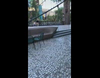 Friend squats fixes black dress girl railing 