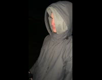 Man gliding through frozen lake on chair