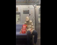 Collab Subway Creatures - Person wear hoodie backwards cover face subway