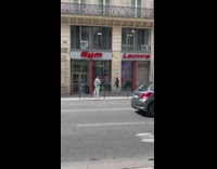 Man poses in front of the gym clothes store