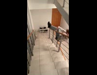 Man falls over stairs rails 