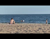 Guy films his two friends in the ocean