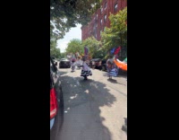 Marching band parading on street part 2