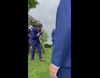 Dog runs down aisle at wedding to groom