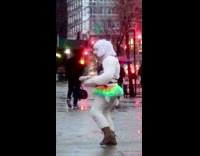 Person in dog costume with lingerie and rainbow skirt