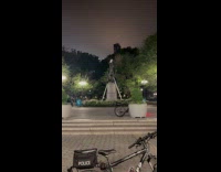 Man climbed statue at park police surrounded