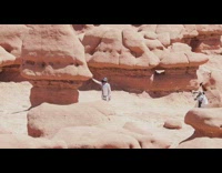 Men shiny silver costume photo shoot canyon