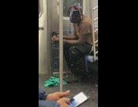 Guy plucks feathers black bird subway 