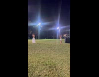 Collab IITW - Woman raises both hands for photo behind